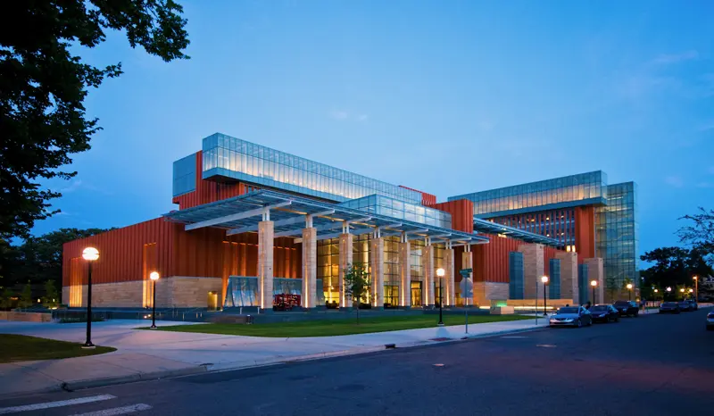 Ross School of Business at University of Michigan featuring split-face Desert Gold sandstone cladding and Moss Green granite accents